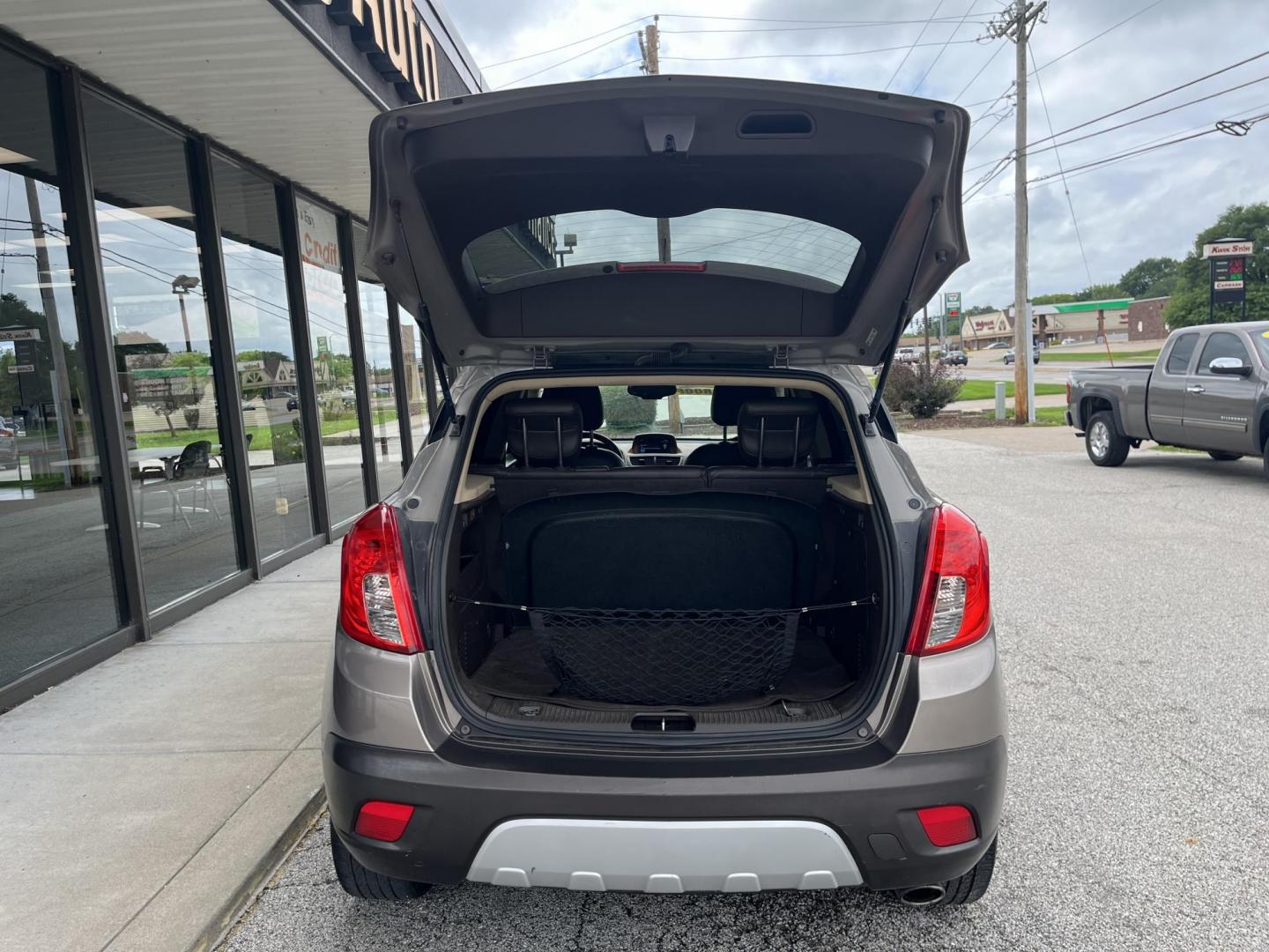 2013 Buick Encore Leather AWD (KL4CJGSB0DB) with an 1.4L L4 DOHC 16V TUR engine, 6-Speed Automatic transmission, located at 1633 W Kimberly, Davenport, IA, 52806, (563) 323-5341, 41.559456, -90.598732 - Photo#5