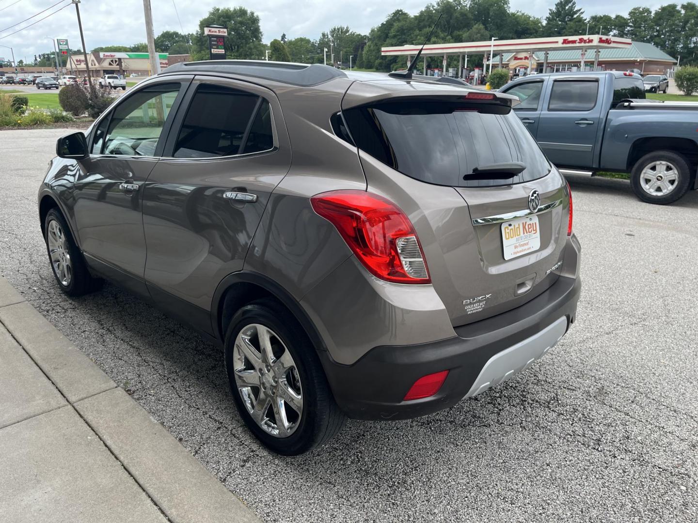 2013 Buick Encore Leather AWD (KL4CJGSB0DB) with an 1.4L L4 DOHC 16V TUR engine, 6-Speed Automatic transmission, located at 1633 W Kimberly, Davenport, IA, 52806, (563) 323-5341, 41.559456, -90.598732 - Photo#3