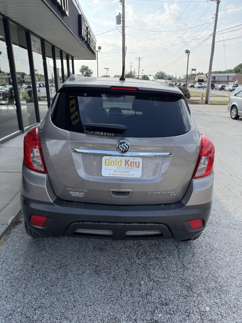 2013 Deep Espresso Brown Buick Encore Leather AWD (KL4CJGSB0DB) with an 1.4L L4 DOHC 16V TUR engine, 6-Speed Automatic transmission, located at 1633 W Kimberly, Davenport, IA, 52806, (563) 323-5341, 41.559456, -90.598732- Photo#2