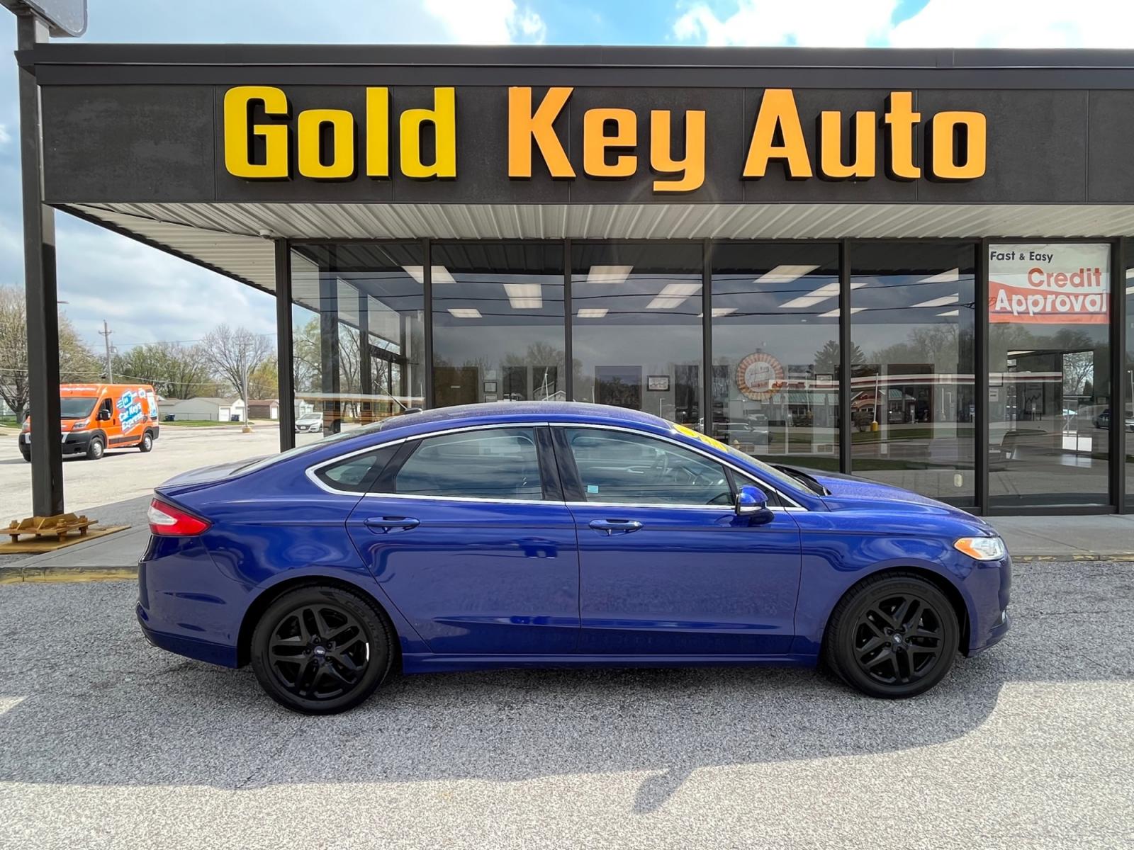 2014 Deep Impact Blue Ford Fusion SE (1FA6P0HD9E5) with an 1.5L L4 DOHC 16V engine, located at 1633 W Kimberly, Davenport, 52806, (563) 323-5341, 41.559456, -90.598732 - Photo #0