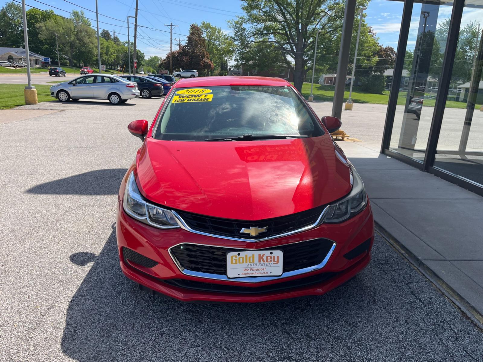 2018 Red Chevrolet Cruze LS Auto (1G1BC5SM8J7) with an 1.4L L4 DOHC 16V TURBO engine, 6-Speed Automatic transmission, located at 1633 W Kimberly, Davenport, 52806, (563) 323-5341, 41.559456, -90.598732 - Photo #2