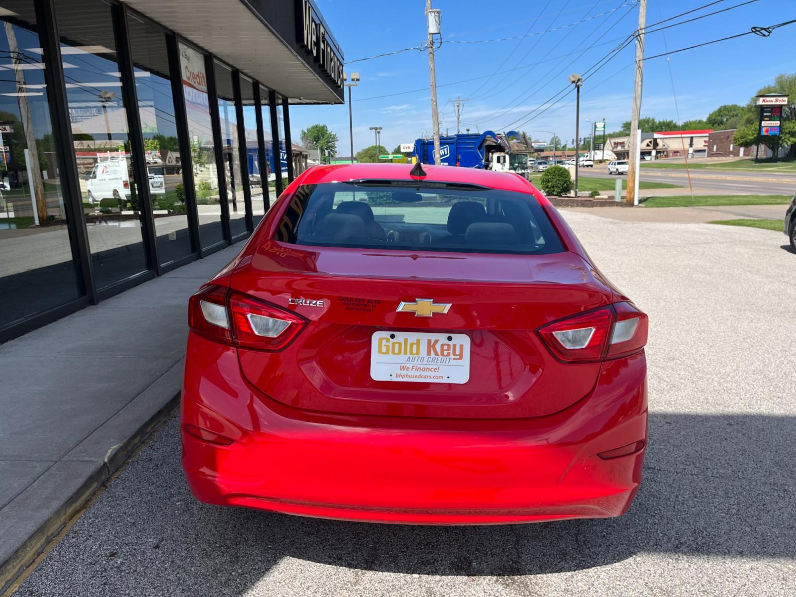 2018 Red Chevrolet Cruze LS Auto (1G1BC5SM8J7) with an 1.4L L4 DOHC 16V TURBO engine, 6-Speed Automatic transmission, located at 1633 W Kimberly, Davenport, 52806, (563) 323-5341, 41.559456, -90.598732 - Photo #3