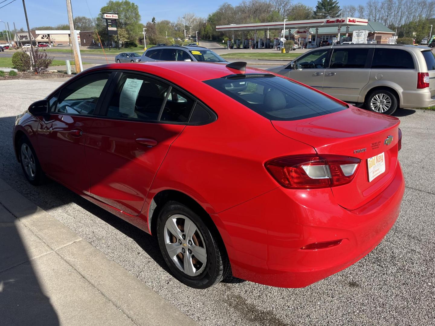 2018 Red Chevrolet Cruze LS Auto (1G1BC5SM8J7) with an 1.4L L4 DOHC 16V TUR engine, 6-Speed Automatic transmission, located at 1633 W Kimberly, Davenport, IA, 52806, (563) 323-5341, 41.559456, -90.598732 - Photo#3