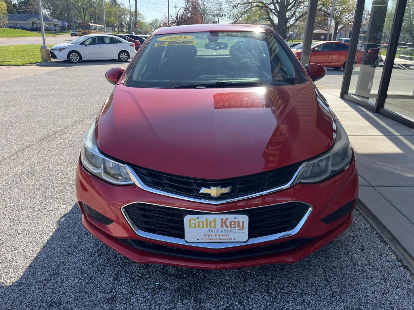 2018 Red Chevrolet Cruze LS Auto (1G1BC5SM8J7) with an 1.4L L4 DOHC 16V TUR engine, 6-Speed Automatic transmission, located at 1633 W Kimberly, Davenport, IA, 52806, (563) 323-5341, 41.559456, -90.598732 - Photo#1