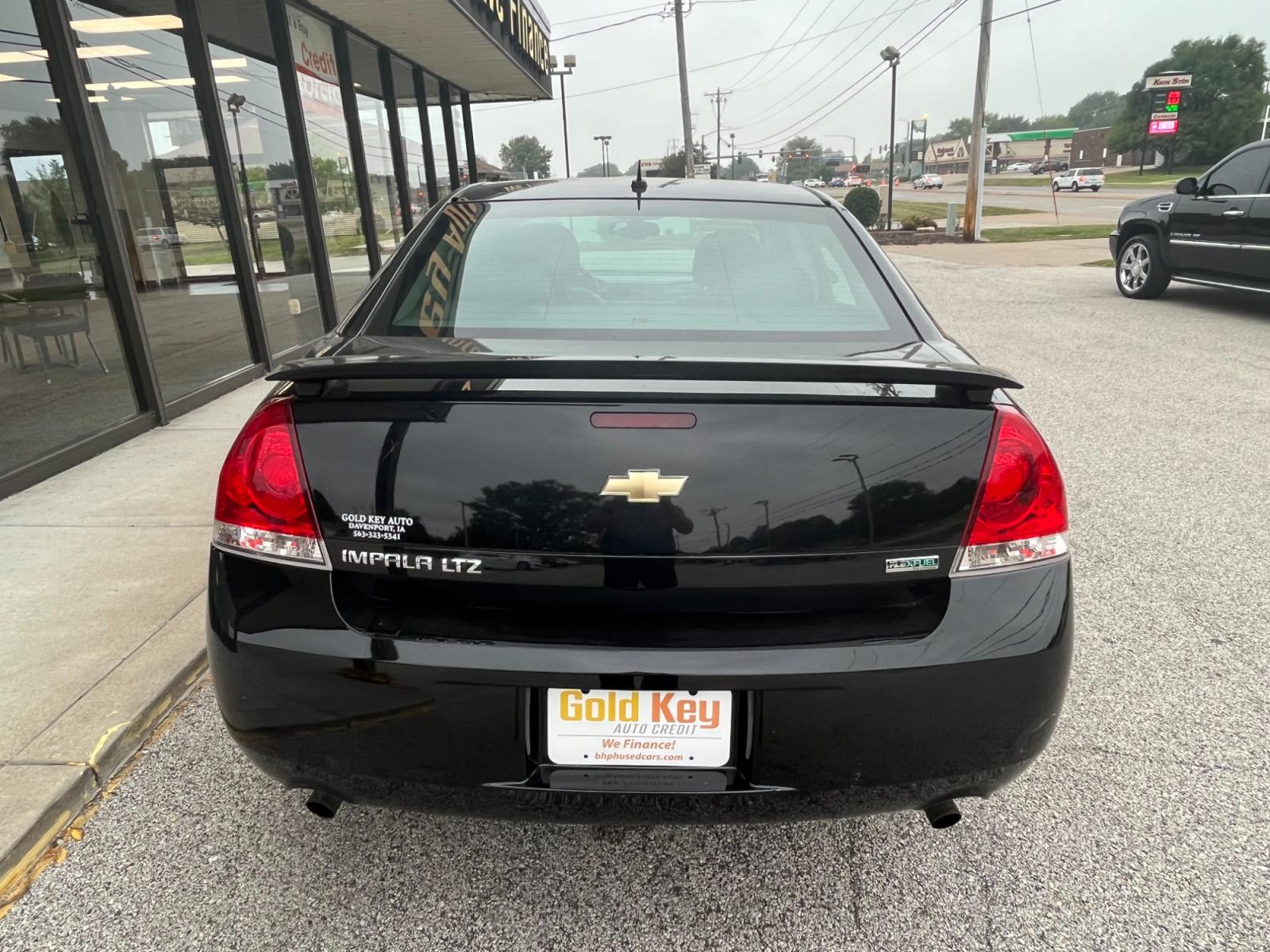 2013 Black Raven Chevrolet Impala LTZ (2G1WC5E36D1) with an 3.6L V6 DOHC 16V FFV engine, 6-Speed Automatic transmission, located at 1633 W Kimberly, Davenport, 52806, (563) 323-5341, 41.559456, -90.598732 - Photo #3