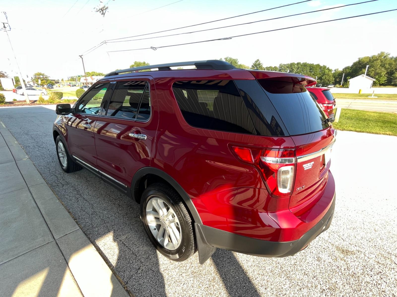 2015 Ruby Red Metallic Tinted Clearcoat Ford Explorer XLT 4WD (1FM5K8D88FG) with an 3.5L V6 DOHC 24V engine, 6-Speed Automatic transmission, located at 1633 W Kimberly, Davenport, 52806, (563) 323-5341, 41.559456, -90.598732 - Photo #2