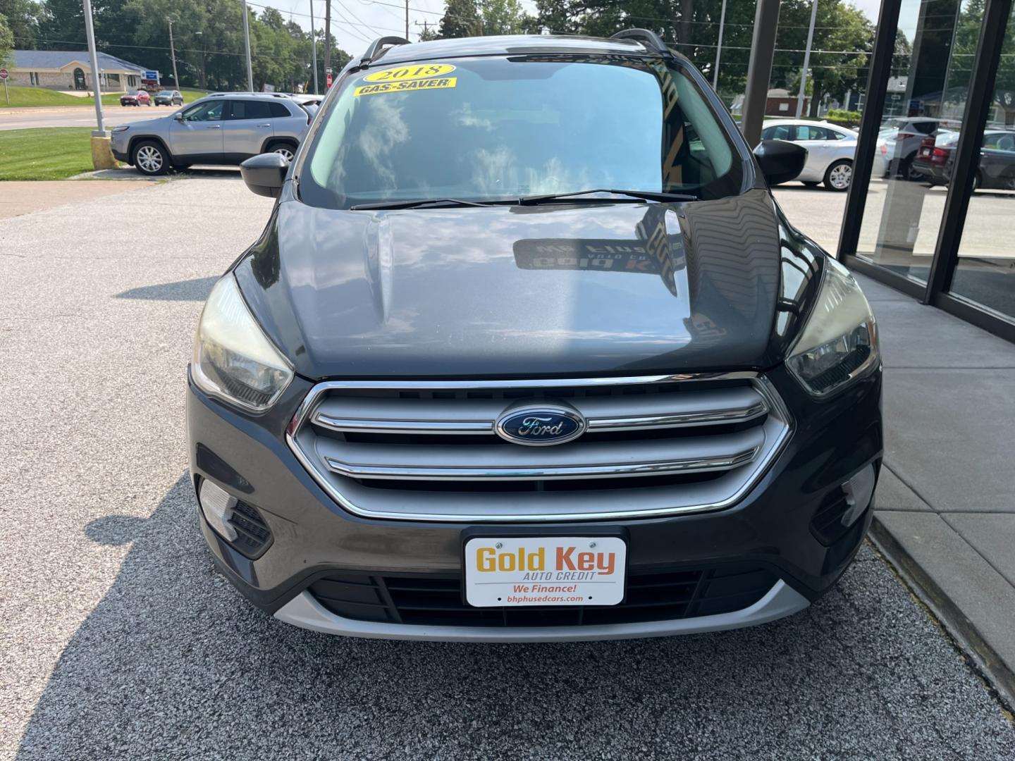 2018 Magnetic Metallic Ford Escape SE FWD (1FMCU0GD3JU) with an 1.5L L4 DOHC 16V engine, 6-Speed Automatic transmission, located at 1633 W Kimberly, Davenport, IA, 52806, (563) 323-5341, 41.559456, -90.598732 - Photo#1