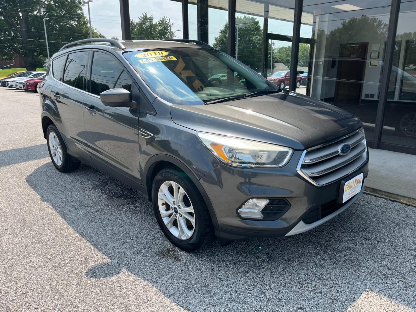 2018 Magnetic Metallic Ford Escape SE FWD (1FMCU0GD3JU) with an 1.5L L4 DOHC 16V engine, 6-Speed Automatic transmission, located at 1633 W Kimberly, Davenport, IA, 52806, (563) 323-5341, 41.559456, -90.598732 - Photo#2