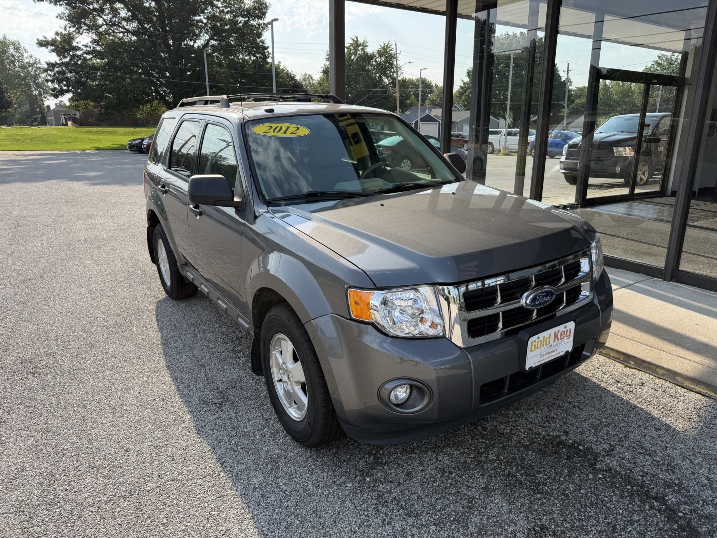 2012 Sterling Grey Metallic Ford Escape XLT FWD (1FMCU0D73CK) with an 2.5L L4 DOHC 16V engine, 6-Speed Automatic transmission, located at 1633 W Kimberly, Davenport, IA, 52806, (563) 323-5341, 41.559456, -90.598732- Photo#1