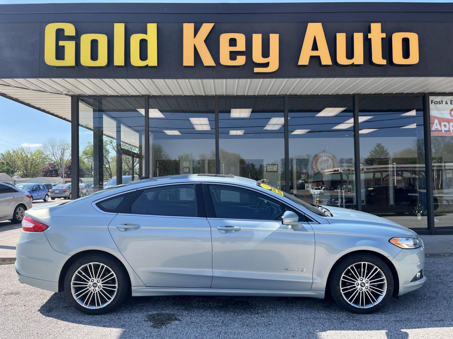 2013 Ginger Ale Ford Fusion Hybrid SE (3FA6P0LU8DR) with an 2.0L L4 DOHC 16V HYB engine, CVT transmission, located at 1633 W Kimberly, Davenport, IA, 52806, (563) 323-5341, 41.559456, -90.598732 - Photo#0