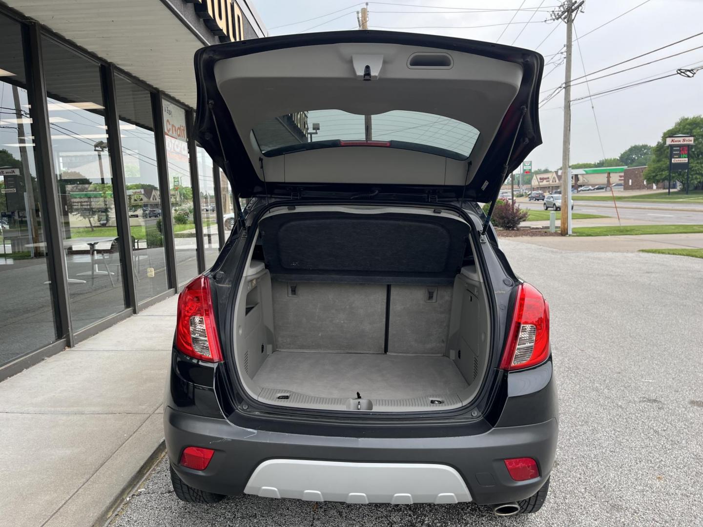 2016 Carbon Black Metalli Buick Encore Leather AWD (KL4CJGSB1GB) with an 1.4L L4 DOHC 16V TUR engine, 6-Speed Automatic transmission, located at 1633 W Kimberly, Davenport, IA, 52806, (563) 323-5341, 41.559456, -90.598732 - Photo#5