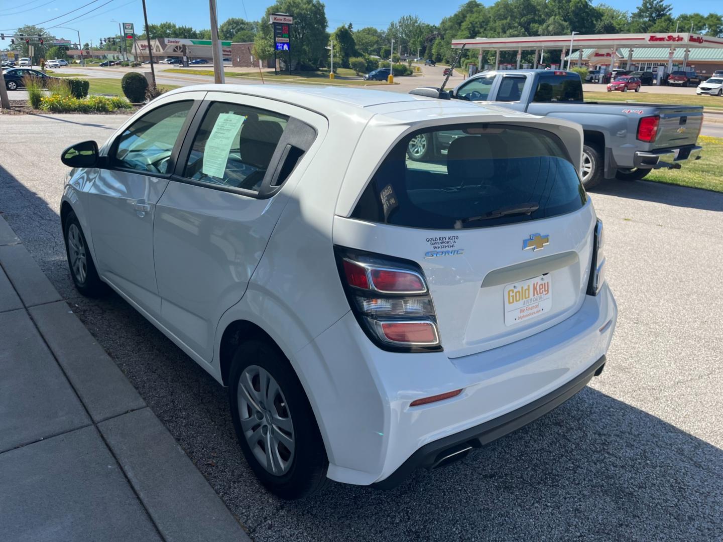 2017 White Chevrolet Sonic FL Auto Hatchback (1G1JG6SH4H4) with an 1.8L L4 DOHC 24V engine, 6-Speed Automatic transmission, located at 1633 W Kimberly, Davenport, IA, 52806, (563) 323-5341, 41.559456, -90.598732 - Photo#3