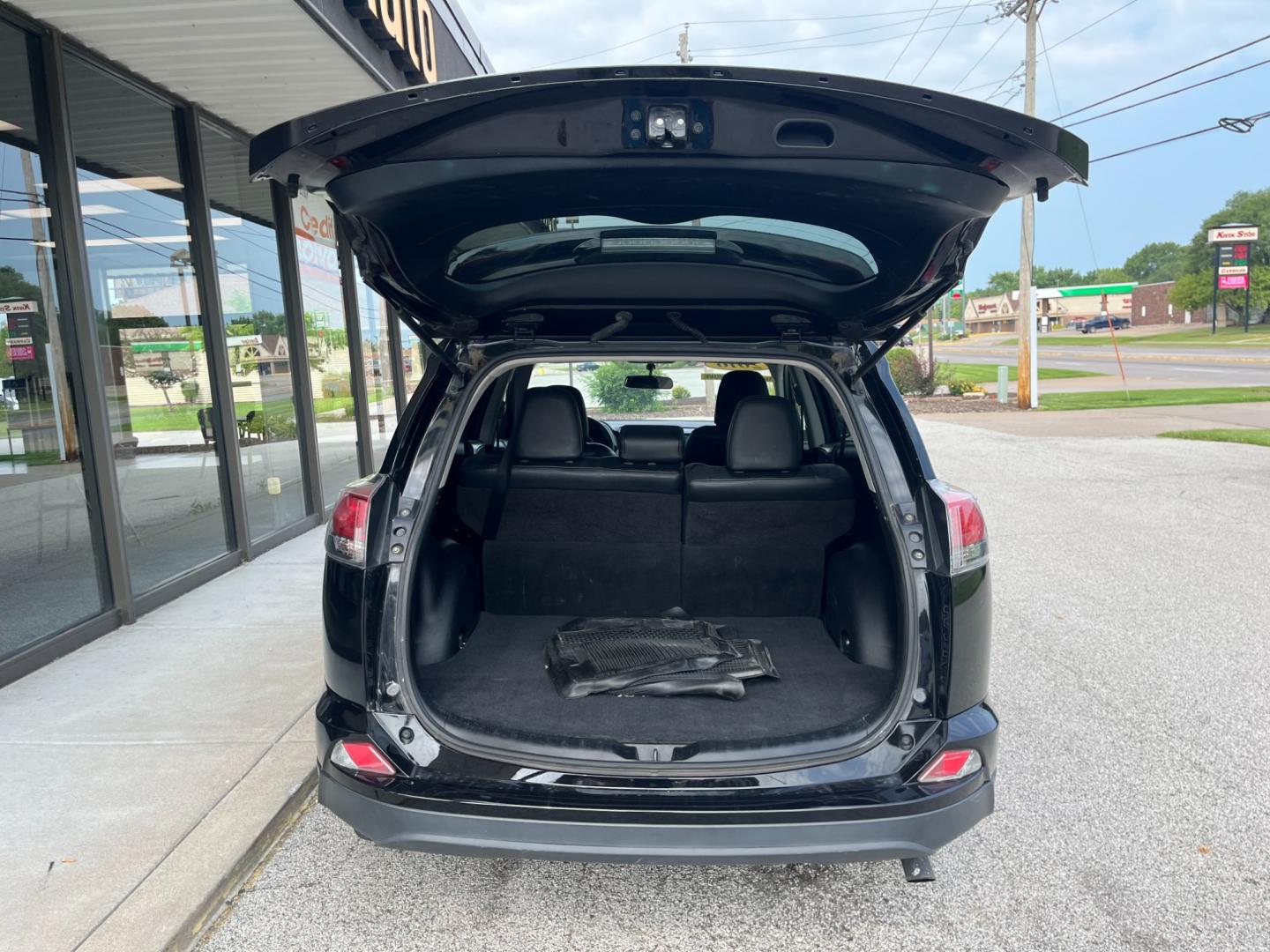 2016 Black Toyota RAV4 LE AWD (2T3BFREV1GW) with an 2.5L L4 DOHC 16V engine, 6-Speed Automatic transmission, located at 1633 W Kimberly, Davenport, IA, 52806, (563) 323-5341, 41.559456, -90.598732 - Photo#4