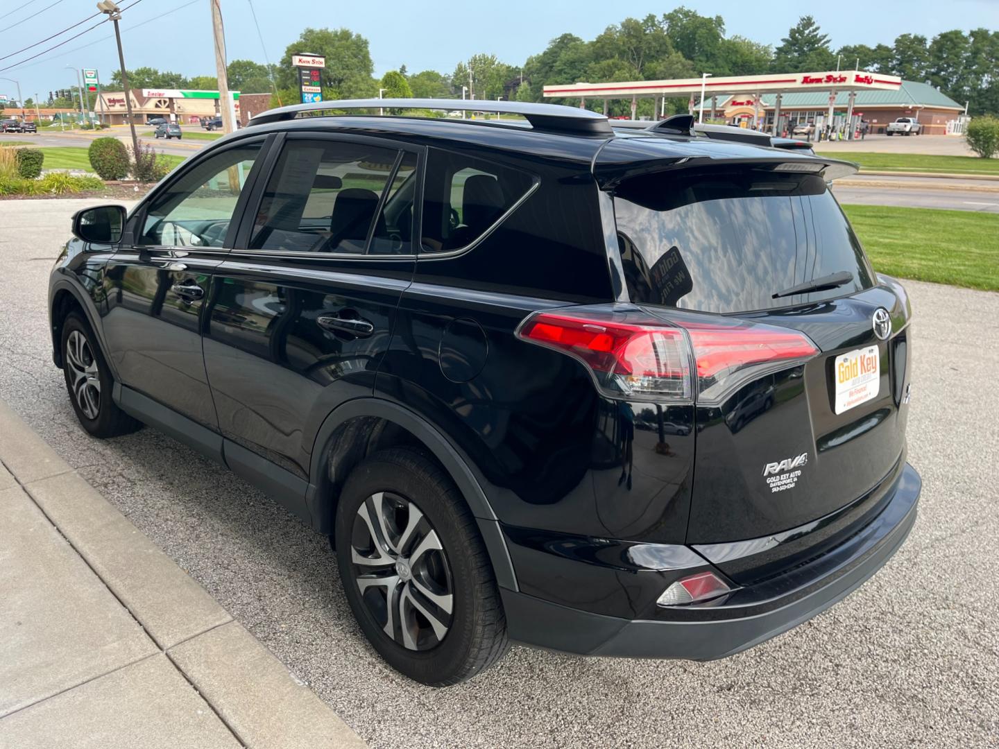 2016 Black Toyota RAV4 LE AWD (2T3BFREV1GW) with an 2.5L L4 DOHC 16V engine, 6-Speed Automatic transmission, located at 1633 W Kimberly, Davenport, IA, 52806, (563) 323-5341, 41.559456, -90.598732 - Photo#2