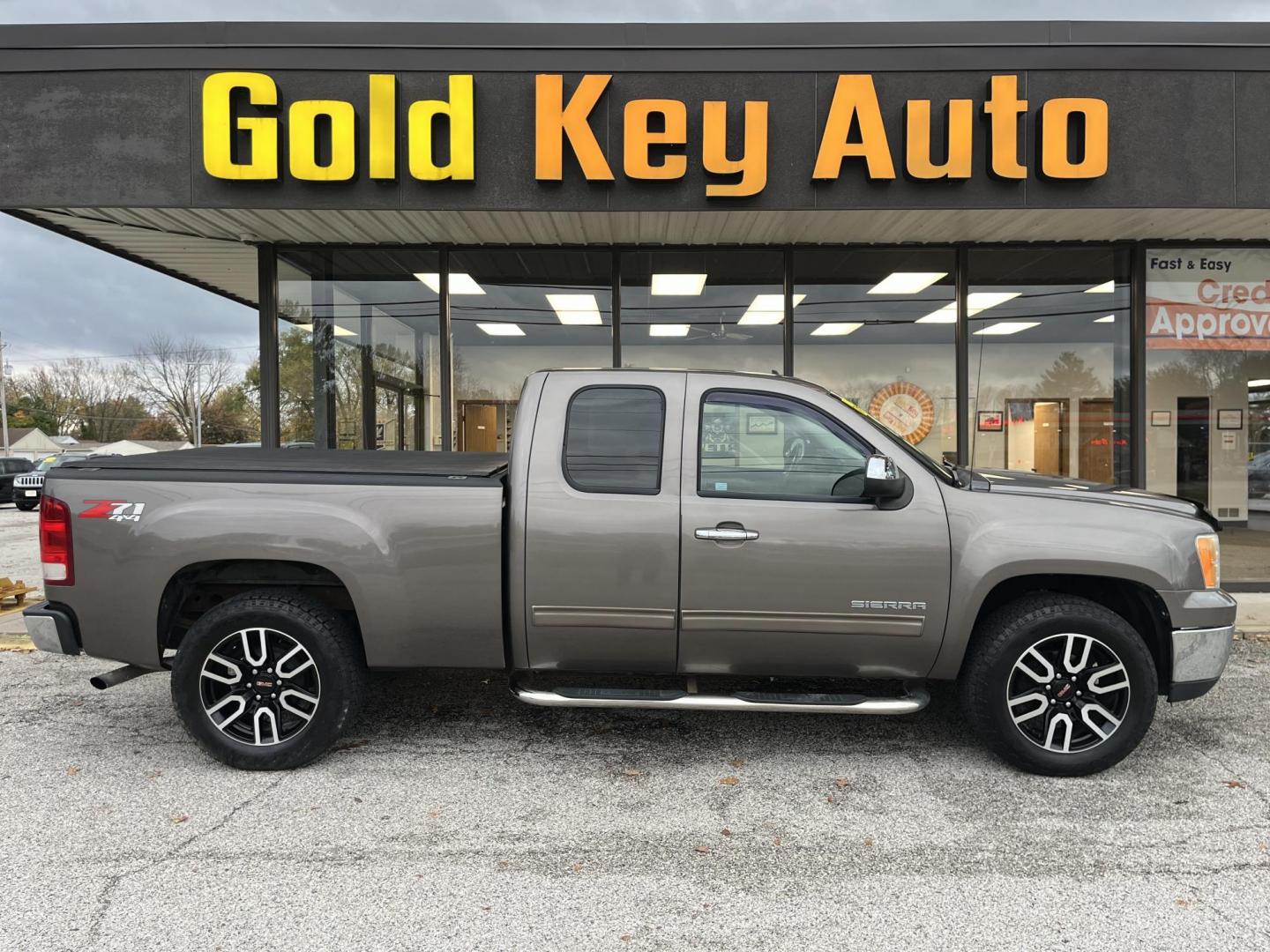 2011 Mocha Bronze GMC Sierra 1500 SLE Ext. Cab 4WD (1GTR2VE37BZ) with an 5.3L V8 OHV 16V FFV engine, 6-Speed Automatic transmission, located at 1633 W Kimberly, Davenport, IA, 52806, (563) 323-5341, 41.559456, -90.598732 - Photo#0