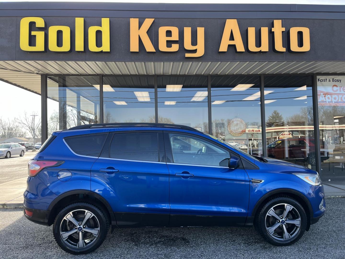 2017 Lightning Blue Metallic Ford Escape SE FWD (1FMCU0GD8HU) with an 1.5L L4 DOHC 16V engine, 6-Speed Automatic transmission, located at 1633 W Kimberly, Davenport, IA, 52806, (563) 323-5341, 41.559456, -90.598732 - Photo#0