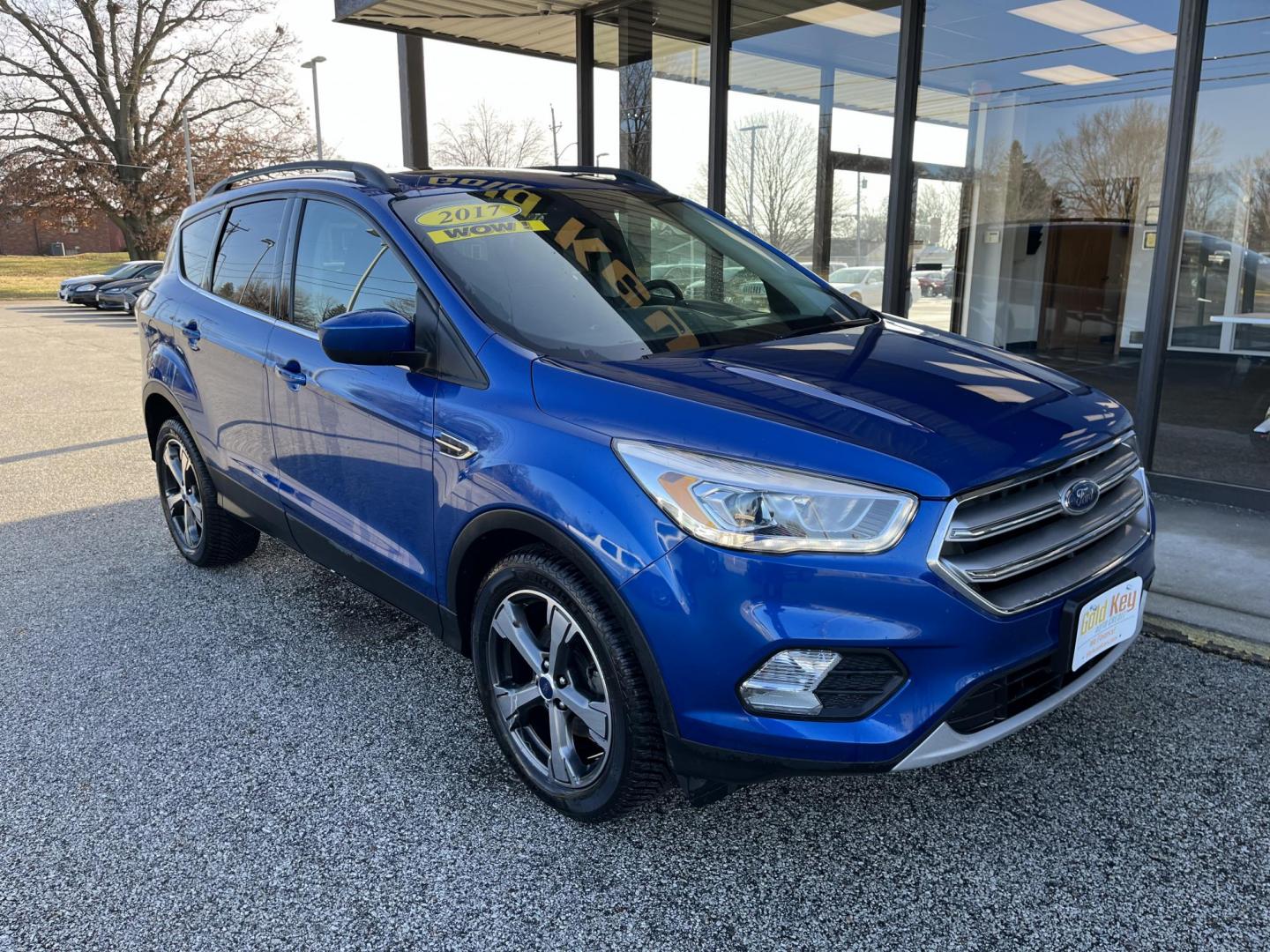 2017 Lightning Blue Metallic Ford Escape SE FWD (1FMCU0GD8HU) with an 1.5L L4 DOHC 16V engine, 6-Speed Automatic transmission, located at 1633 W Kimberly, Davenport, IA, 52806, (563) 323-5341, 41.559456, -90.598732 - Photo#2