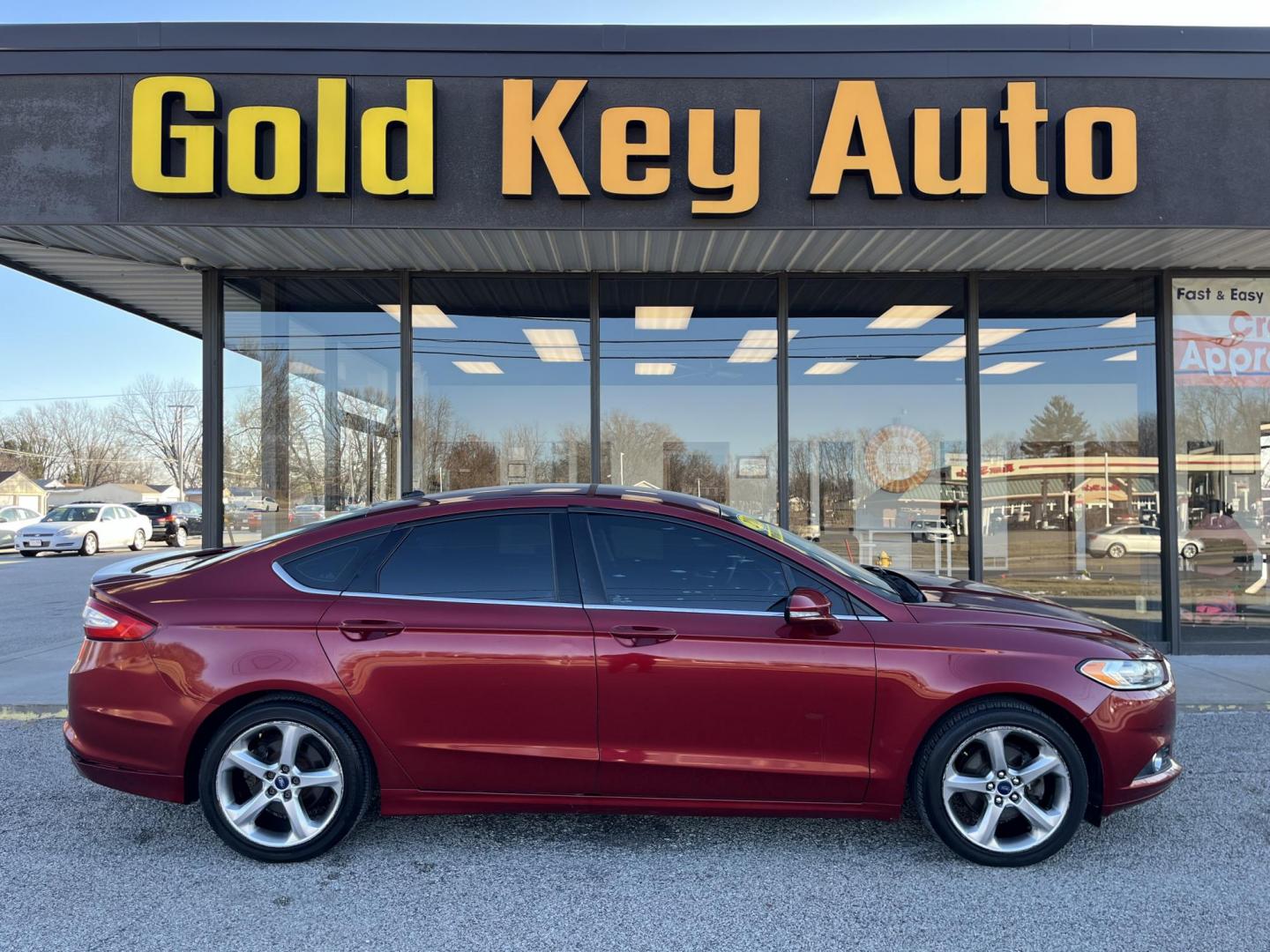 2013 Ruby Red Met Tinted CC Ford Fusion SE (3FA6P0H73DR) with an 2.5L L4 DOHC 16V engine, located at 1633 W Kimberly, Davenport, IA, 52806, (563) 323-5341, 41.559456, -90.598732 - Photo#0