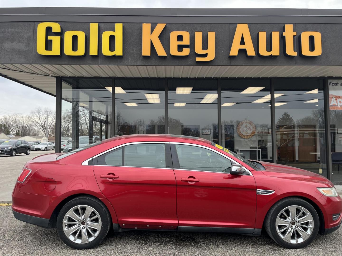 2011 Red Candy Metallic Tinted Clearcoat Ford Taurus Limited (1FAHP2JW2BG) with an Duratec 3.5L V-6 DOHC engine, located at 1633 W Kimberly, Davenport, IA, 52806, (563) 323-5341, 41.559456, -90.598732 - Photo#0