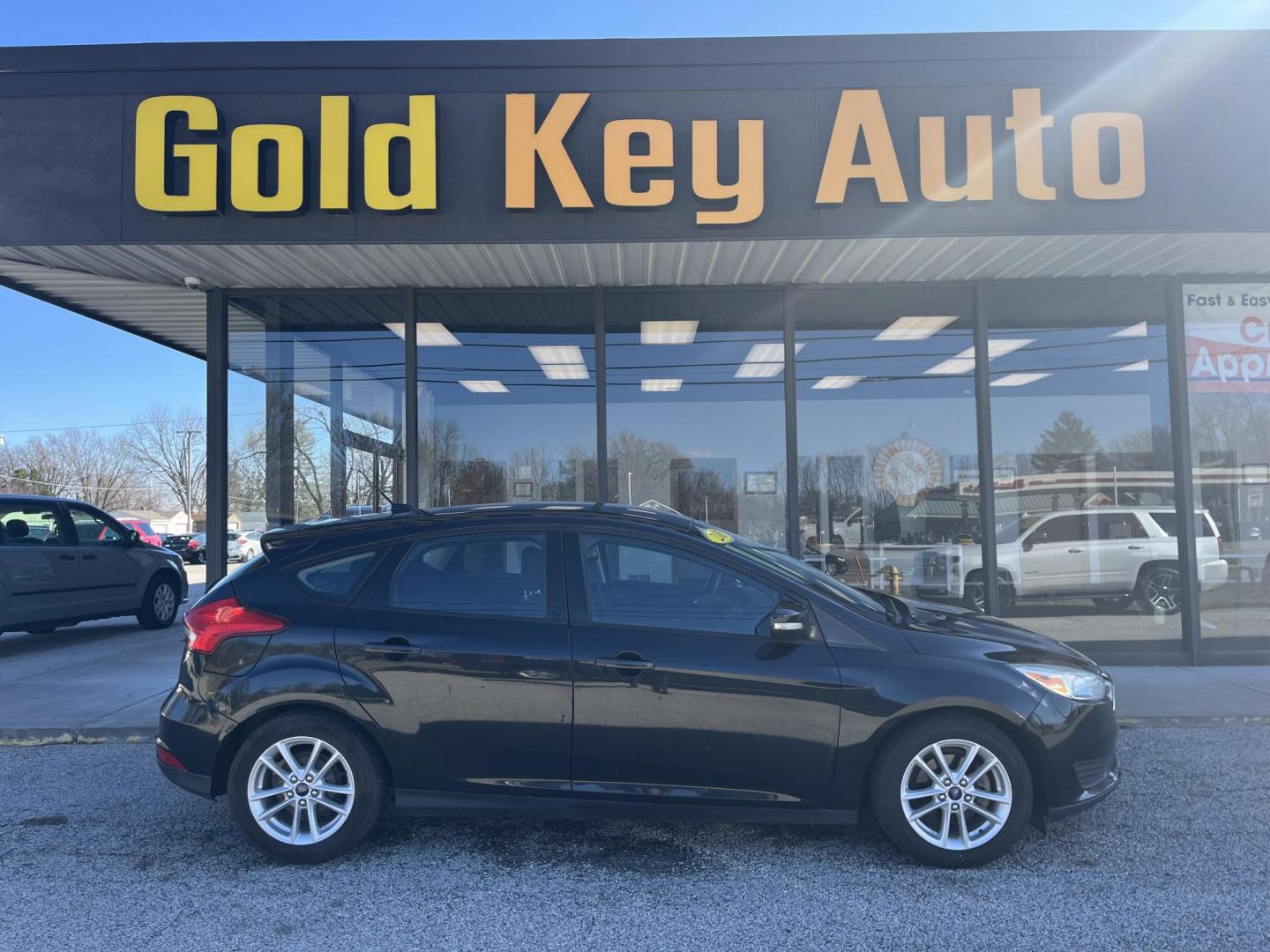 2015 Black Ford Focus SE Hatch (1FADP3K23FL) with an 2.0L L4 DOHC 16V engine, 5-Speed Manual transmission, located at 1633 W Kimberly, Davenport, IA, 52806, (563) 323-5341, 41.559456, -90.598732 - Photo#0