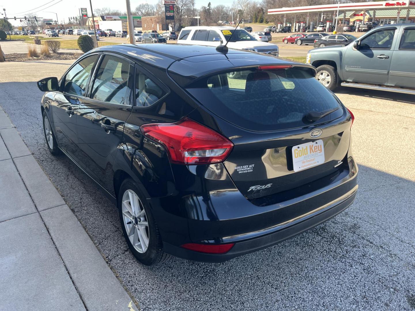 2015 Black Ford Focus SE Hatch (1FADP3K23FL) with an 2.0L L4 DOHC 16V engine, 5-Speed Manual transmission, located at 1633 W Kimberly, Davenport, IA, 52806, (563) 323-5341, 41.559456, -90.598732 - Photo#3