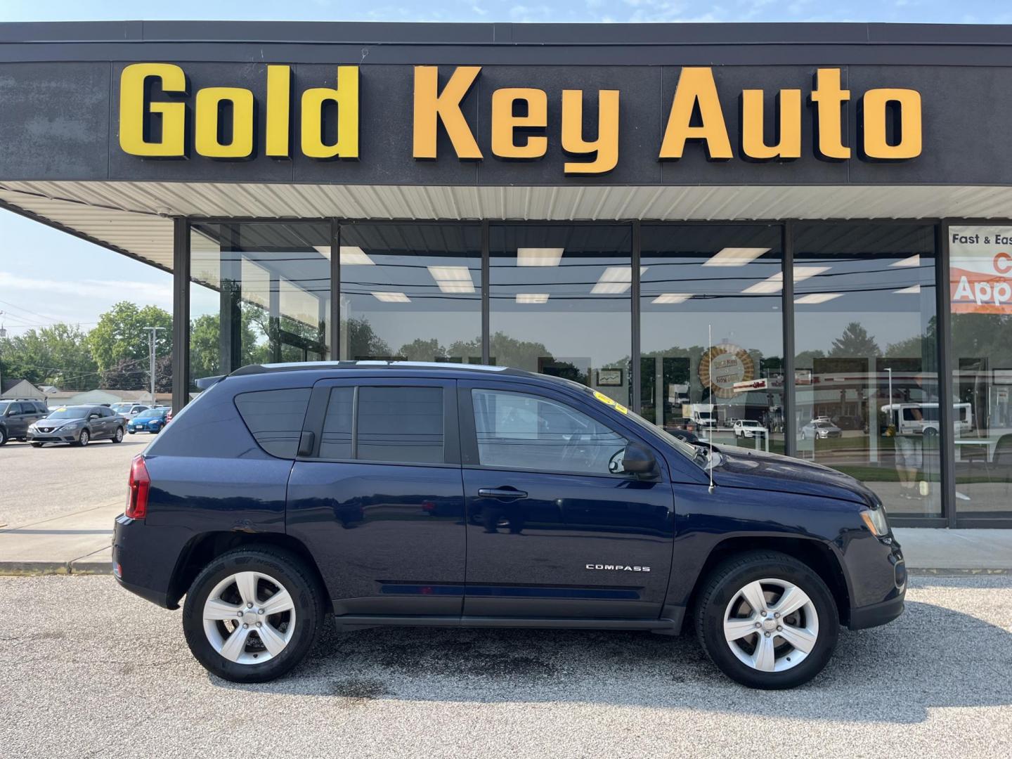 2016 True Blue Pearlcoat Jeep Compass Sport (1C4NJDBB9GD) with an 2.4L I-4 DOHC engine, located at 1633 W Kimberly, Davenport, IA, 52806, (563) 323-5341, 41.559456, -90.598732 - Photo#0