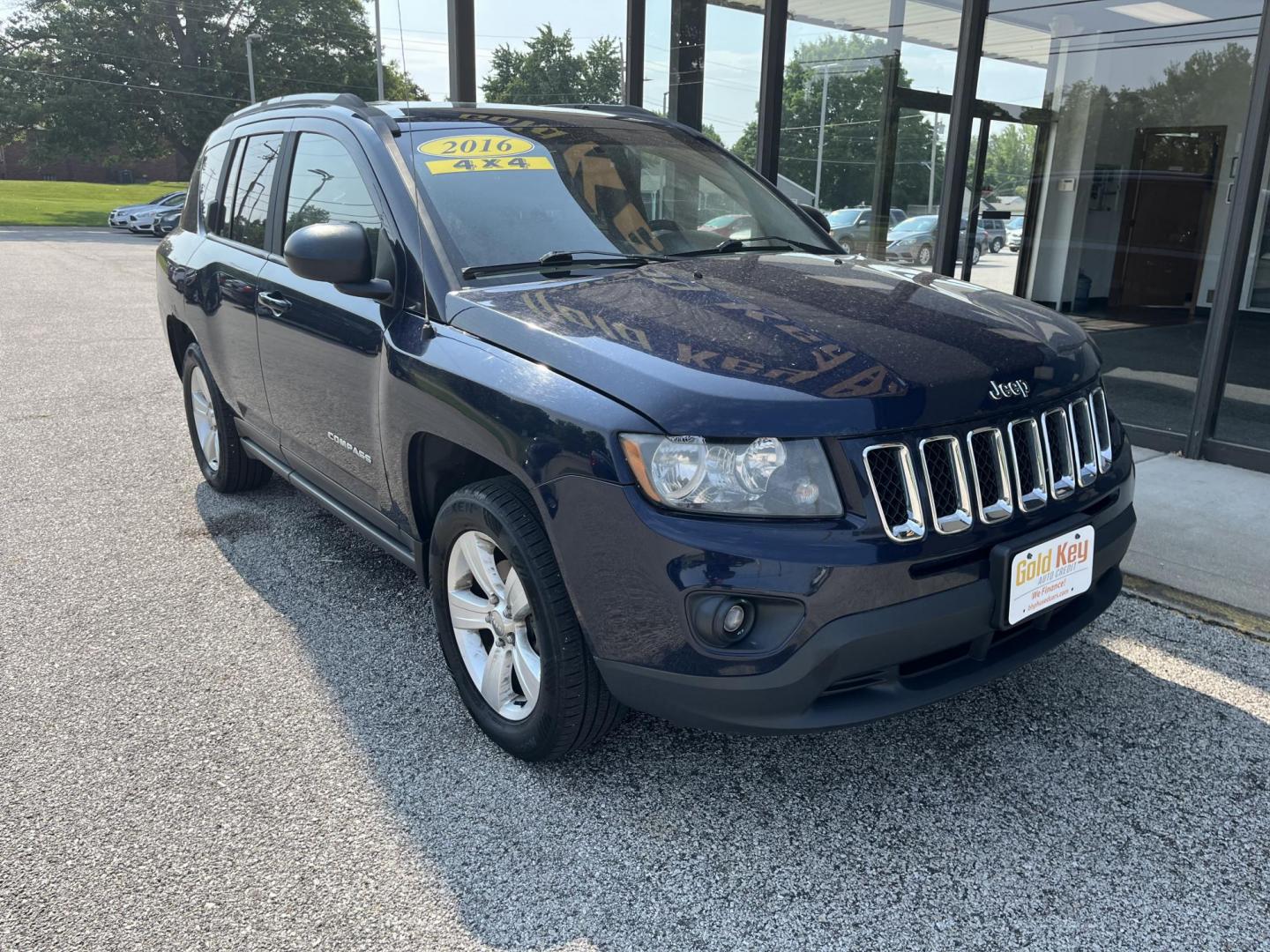 2016 True Blue Pearlcoat Jeep Compass Sport (1C4NJDBB9GD) with an 2.4L I-4 DOHC engine, located at 1633 W Kimberly, Davenport, IA, 52806, (563) 323-5341, 41.559456, -90.598732 - Photo#2