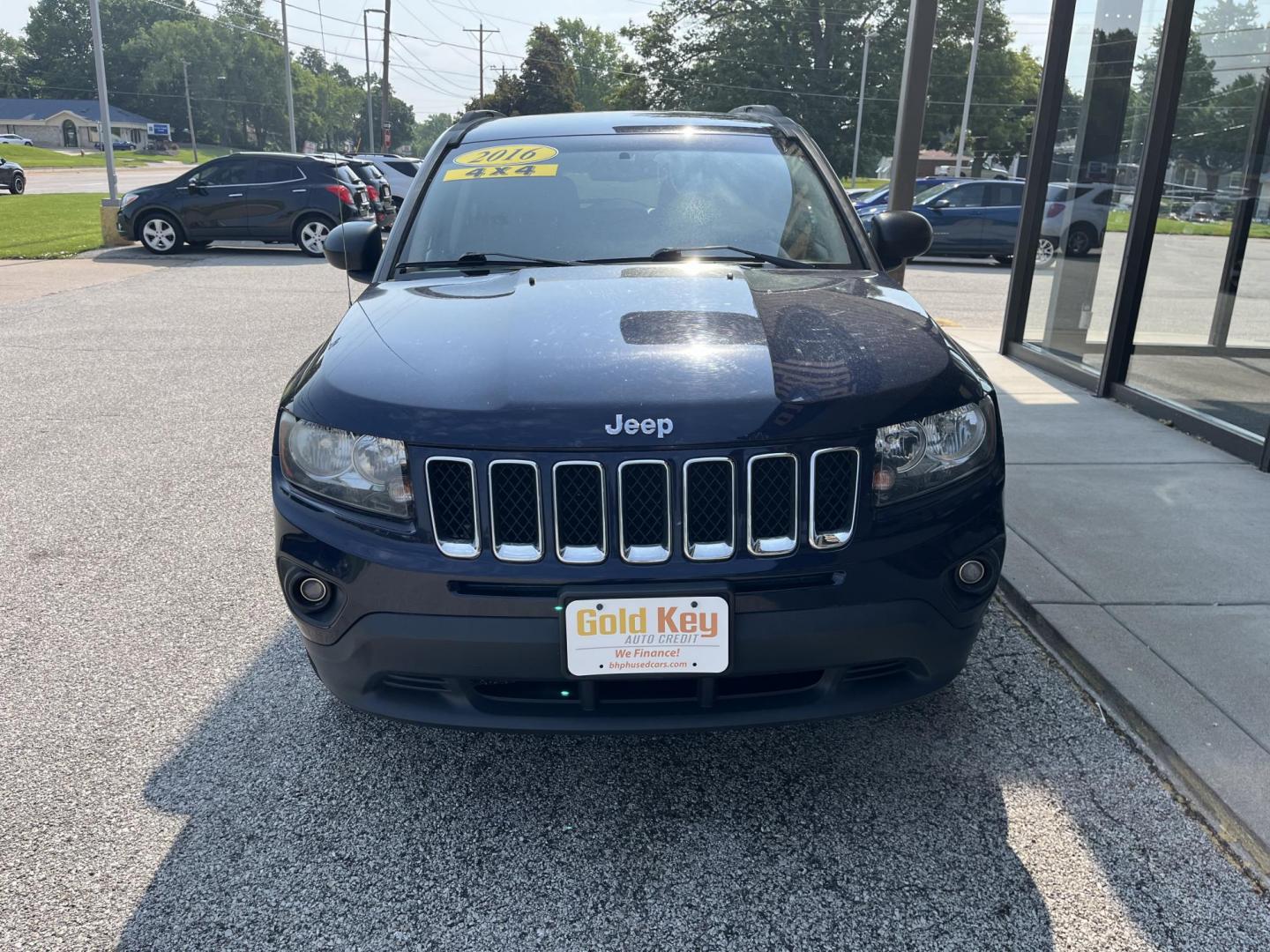 2016 True Blue Pearlcoat Jeep Compass Sport (1C4NJDBB9GD) with an 2.4L I-4 DOHC engine, located at 1633 W Kimberly, Davenport, IA, 52806, (563) 323-5341, 41.559456, -90.598732 - Photo#1