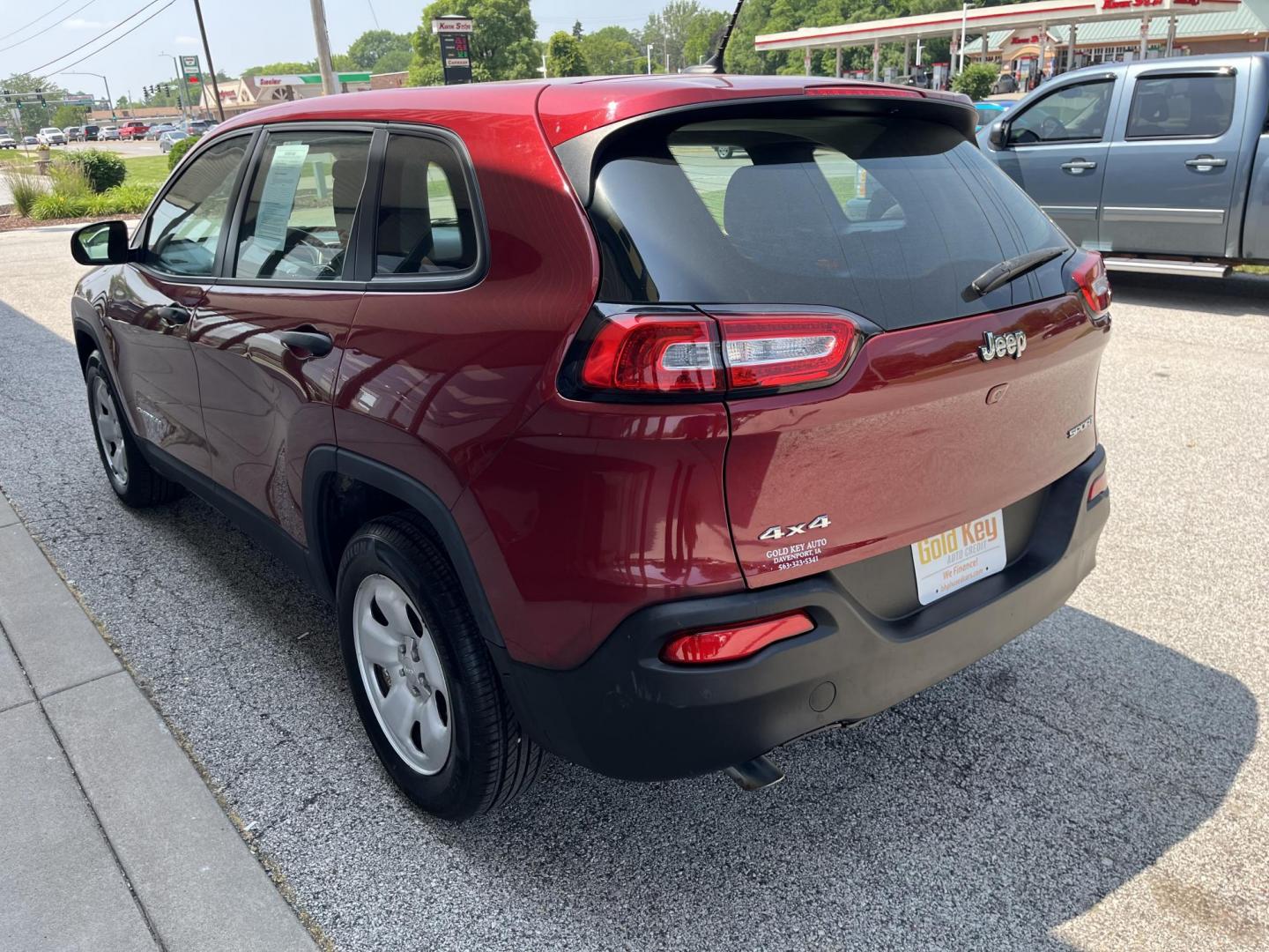 2015 Deep Cherry Red Crystal Pearlcoat Jeep Cherokee Sport (1C4PJMAB9FW) , located at 1633 W Kimberly, Davenport, IA, 52806, (563) 323-5341, 41.559456, -90.598732 - Photo#3