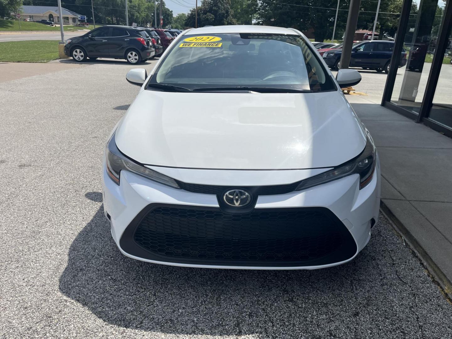 2021 Oxford White Toyota Corolla LE (JTDEPMAEXMJ) with an 1.8L L4 DOHC 16V engine, CVT transmission, located at 1633 W Kimberly, Davenport, IA, 52806, (563) 323-5341, 41.559456, -90.598732 - Photo#1
