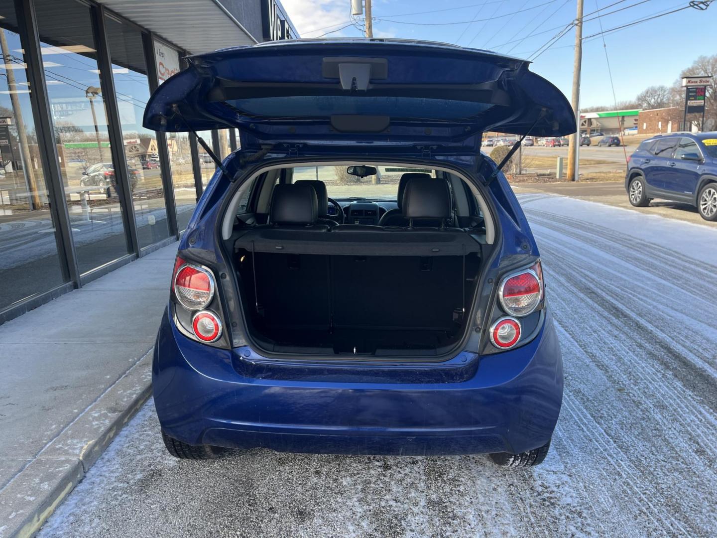 2014 Blue Topaz Metallic Chevrolet Sonic LTZ Auto 5-Door (1G1JE6SB5E4) with an 1.4L L4 DOHC 24V TURBO engine, 6-Speed Automatic transmission, located at 1633 W Kimberly, Davenport, IA, 52806, (563) 323-5341, 41.559456, -90.598732 - Photo#5