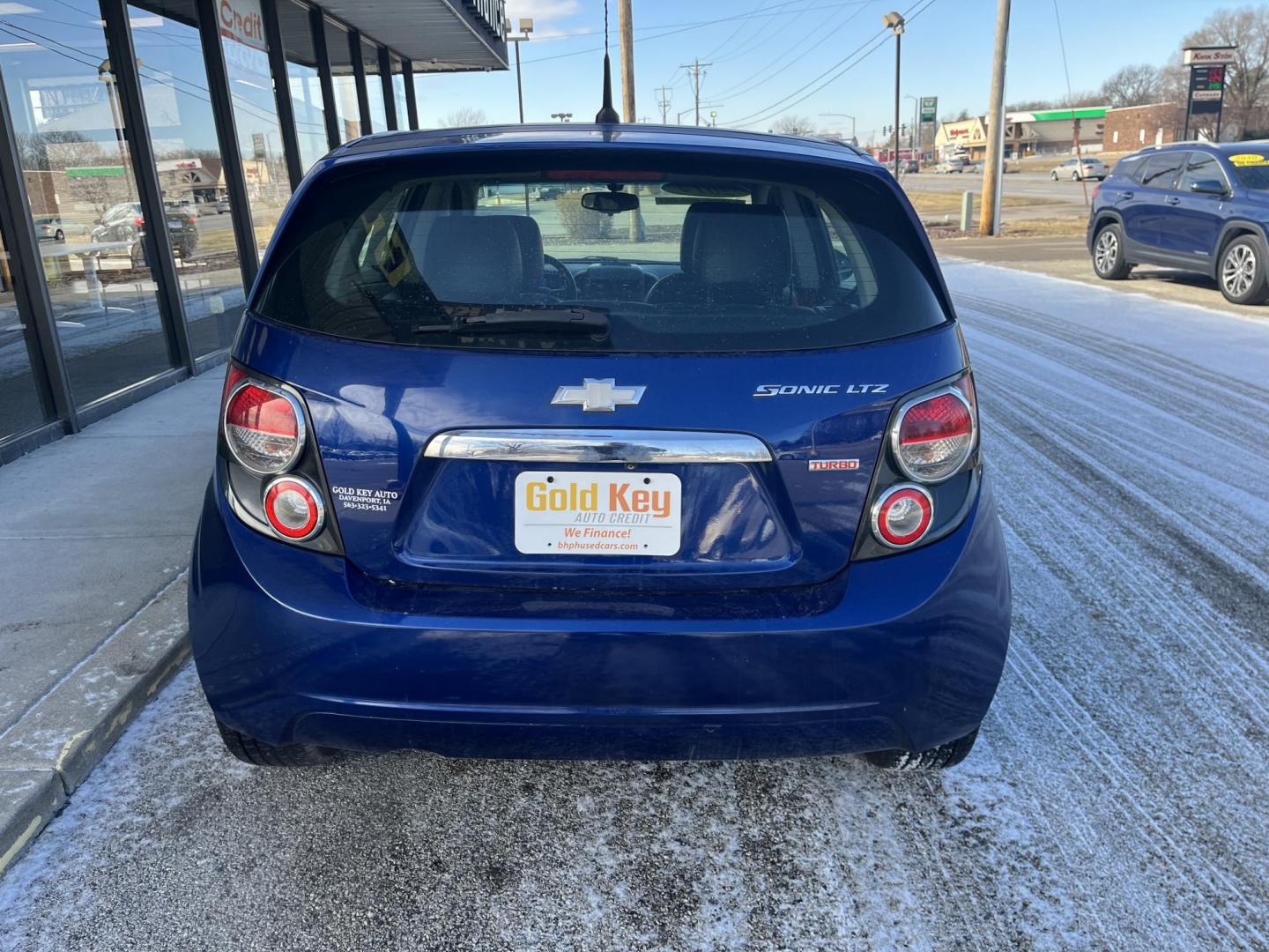 2014 Blue Topaz Metallic Chevrolet Sonic LTZ Auto 5-Door (1G1JE6SB5E4) with an 1.4L L4 DOHC 24V TURBO engine, 6-Speed Automatic transmission, located at 1633 W Kimberly, Davenport, IA, 52806, (563) 323-5341, 41.559456, -90.598732 - Photo#4
