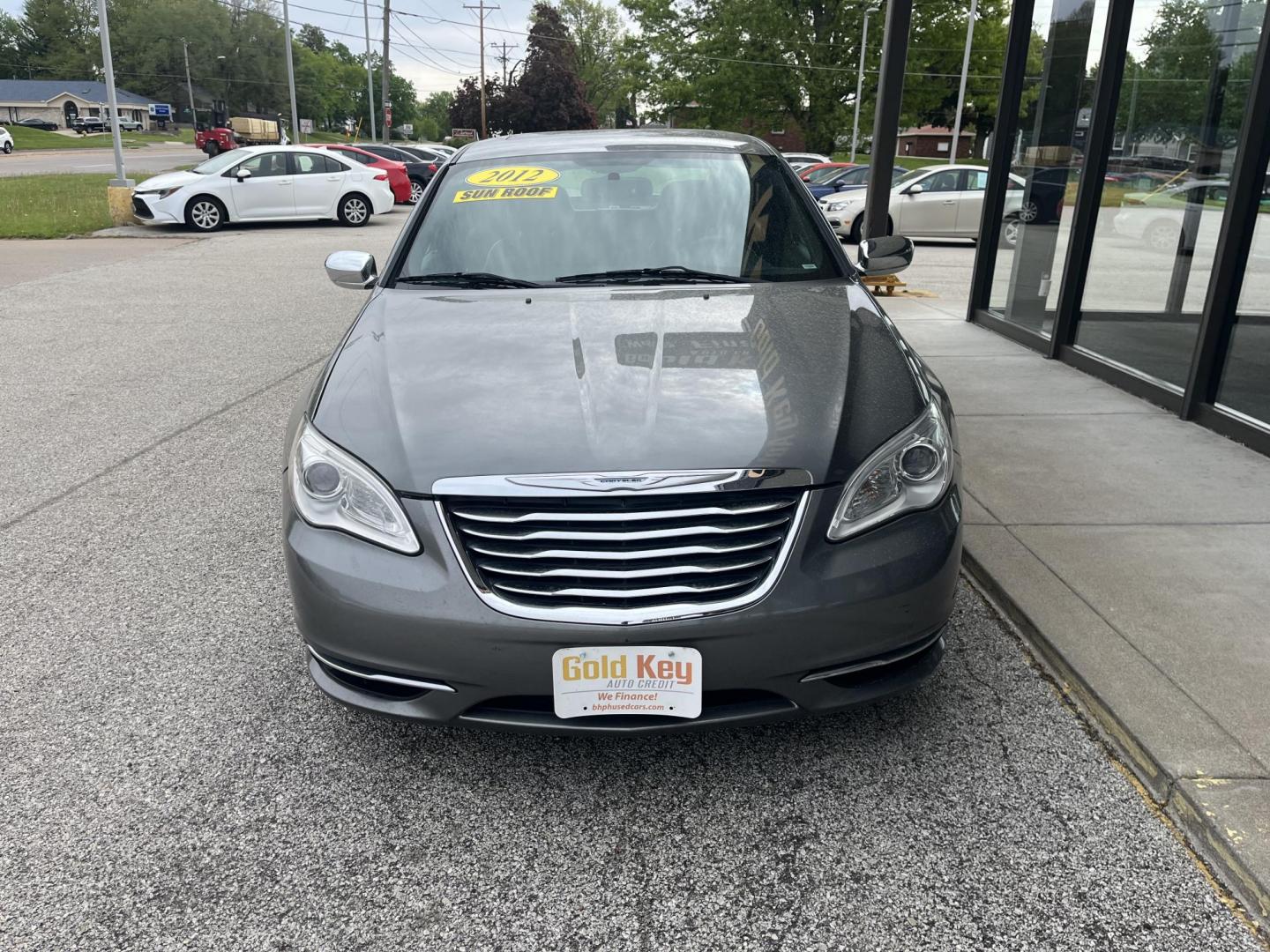2012 Tungsten Metallic Chrysler 200 Limited (1C3CCBCG0CN) with an 3.6L V6 DOHC 24V FFV engine, 6-Speed Automatic transmission, located at 1633 W Kimberly, Davenport, IA, 52806, (563) 323-5341, 41.559456, -90.598732 - Photo#1
