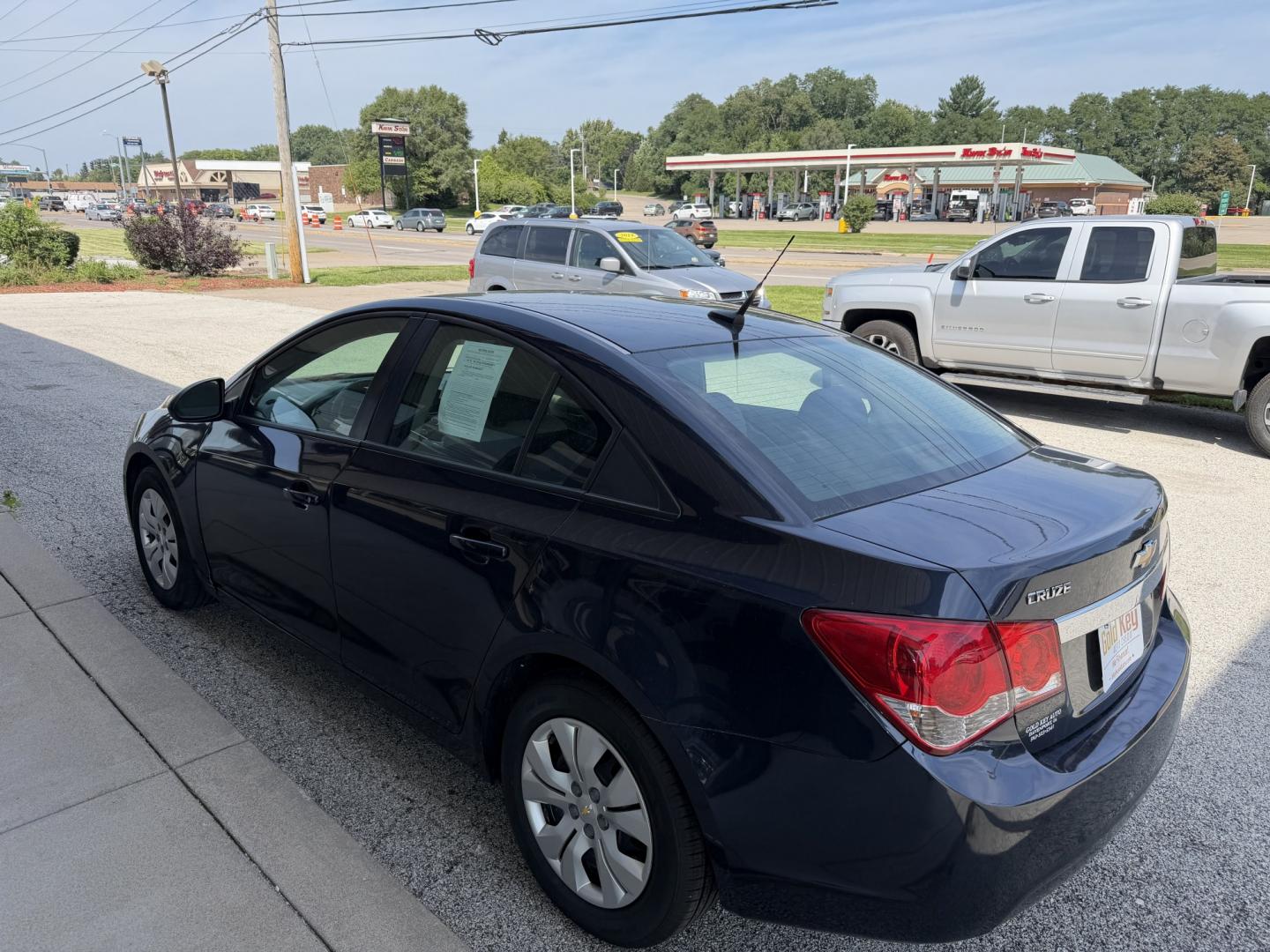 2014 Blue Ray Metallic /Jet Black/Medium Tit Chevrolet Cruze LS Auto (1G1PA5SG4E7) with an 1.8L L4 DOHC 16V engine, 6-Speed Automatic transmission, located at 1633 W Kimberly, Davenport, IA, 52806, (563) 323-5341, 41.559456, -90.598732- Photo#4
