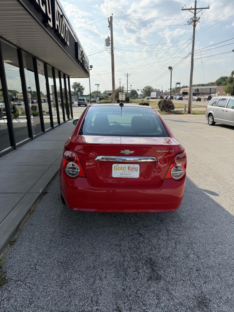2015 Red Hot /Jet Black/Brick Chevrolet Sonic LT Auto Sedan (1G1JC5SG3F4) with an 1.8L L4 DOHC 24V engine, 6-Speed Automatic transmission, located at 1633 W Kimberly, Davenport, IA, 52806, (563) 323-5341, 41.559456, -90.598732- Photo#3